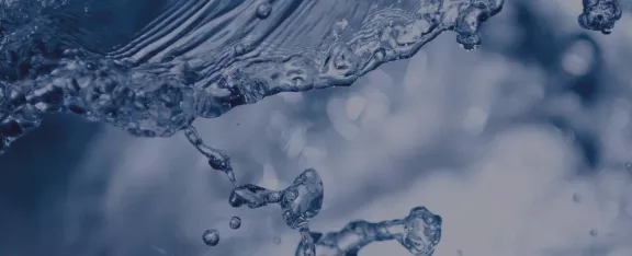 a close up photo of water with surface ripples