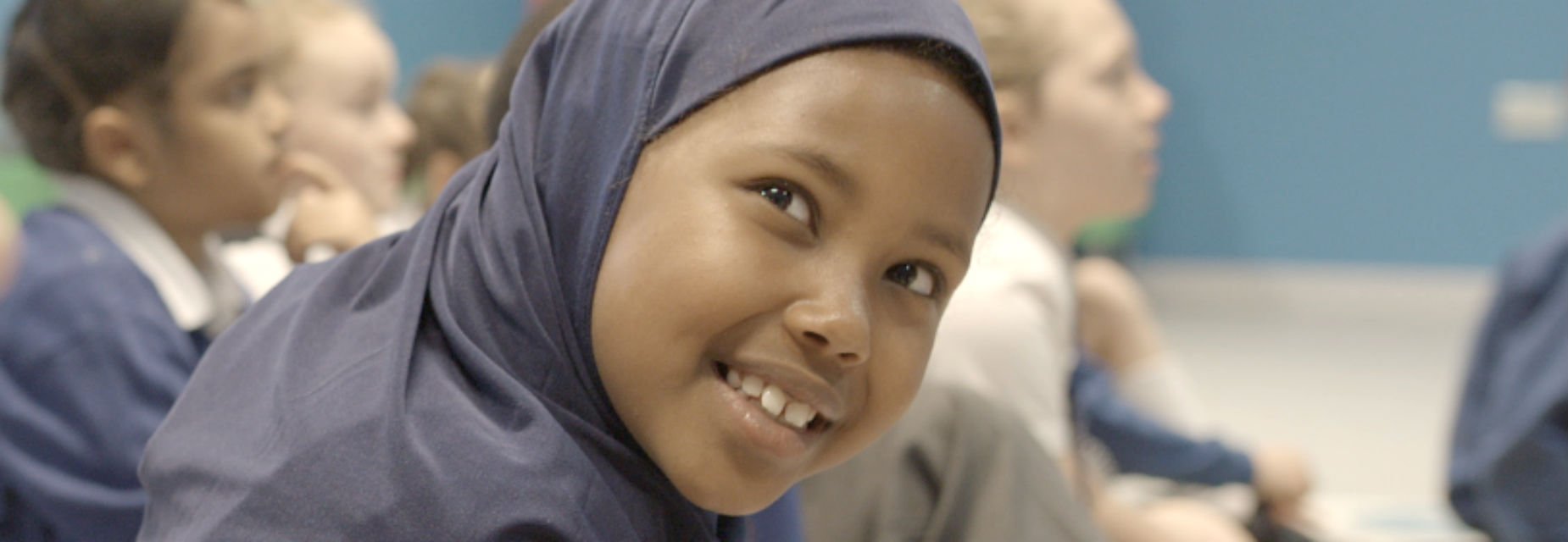 Smiling girl in early years workshop