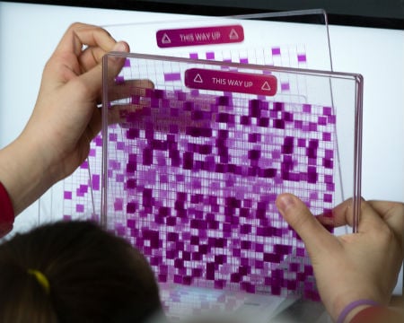 Matching up pixelated images at an exhibit to display the word, 'Hello'