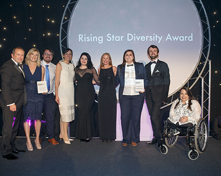 Staff from Glasgow Science Centre collect the 'Rising Star' award at the Diversity Awards.