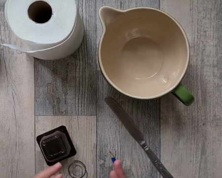 Grid image showing kitchen roll, jug and pencil