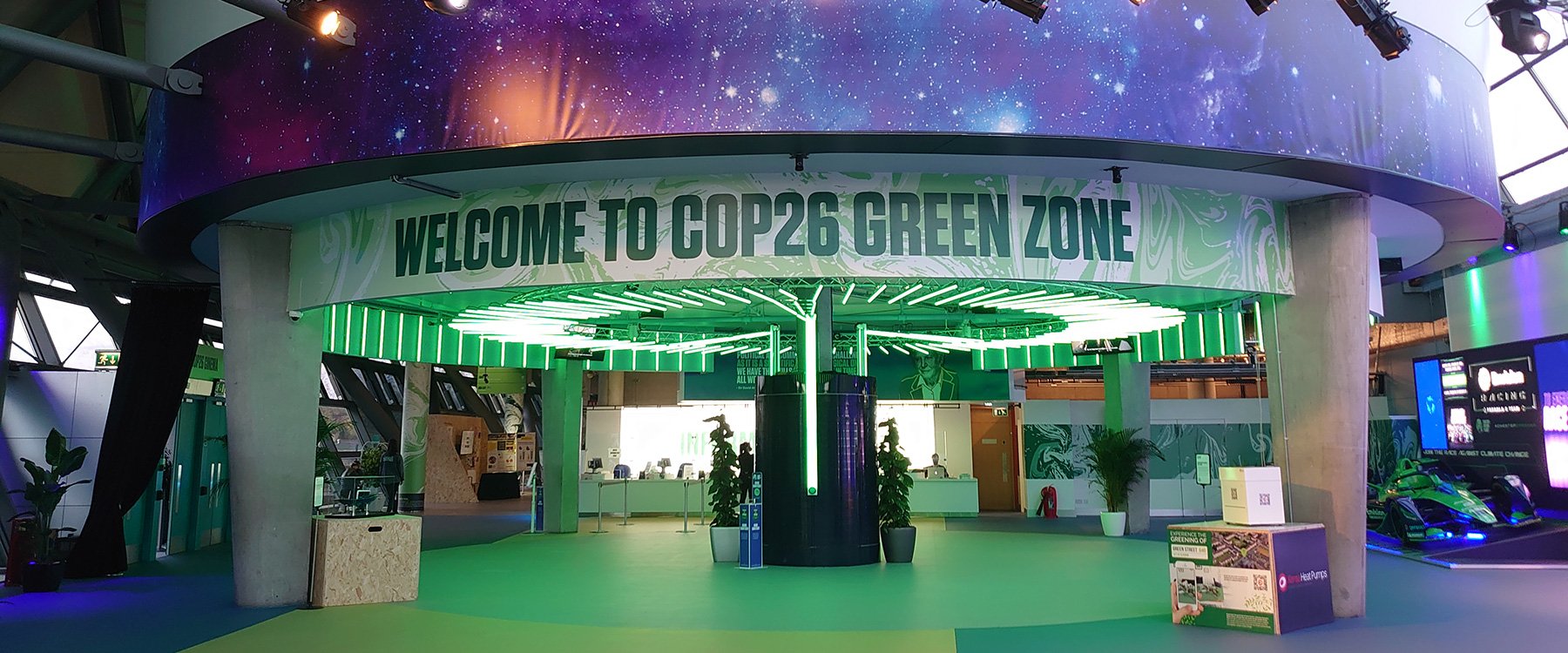 A sign around the underside of the Planetarium reads 'Welcome to the COP26 Green Zone'.