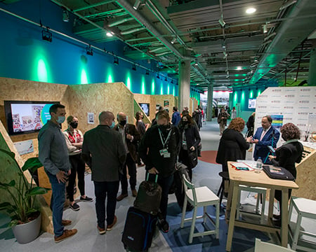 Guests visiting exhibit stands set up in the Clyde Suite 