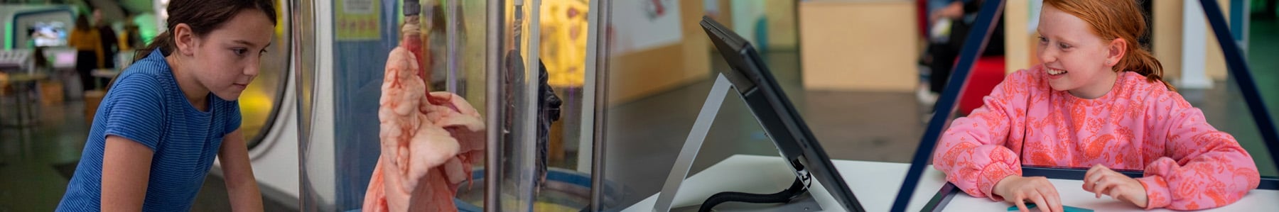 two children interacting with Glasgow Science Centre exhibits