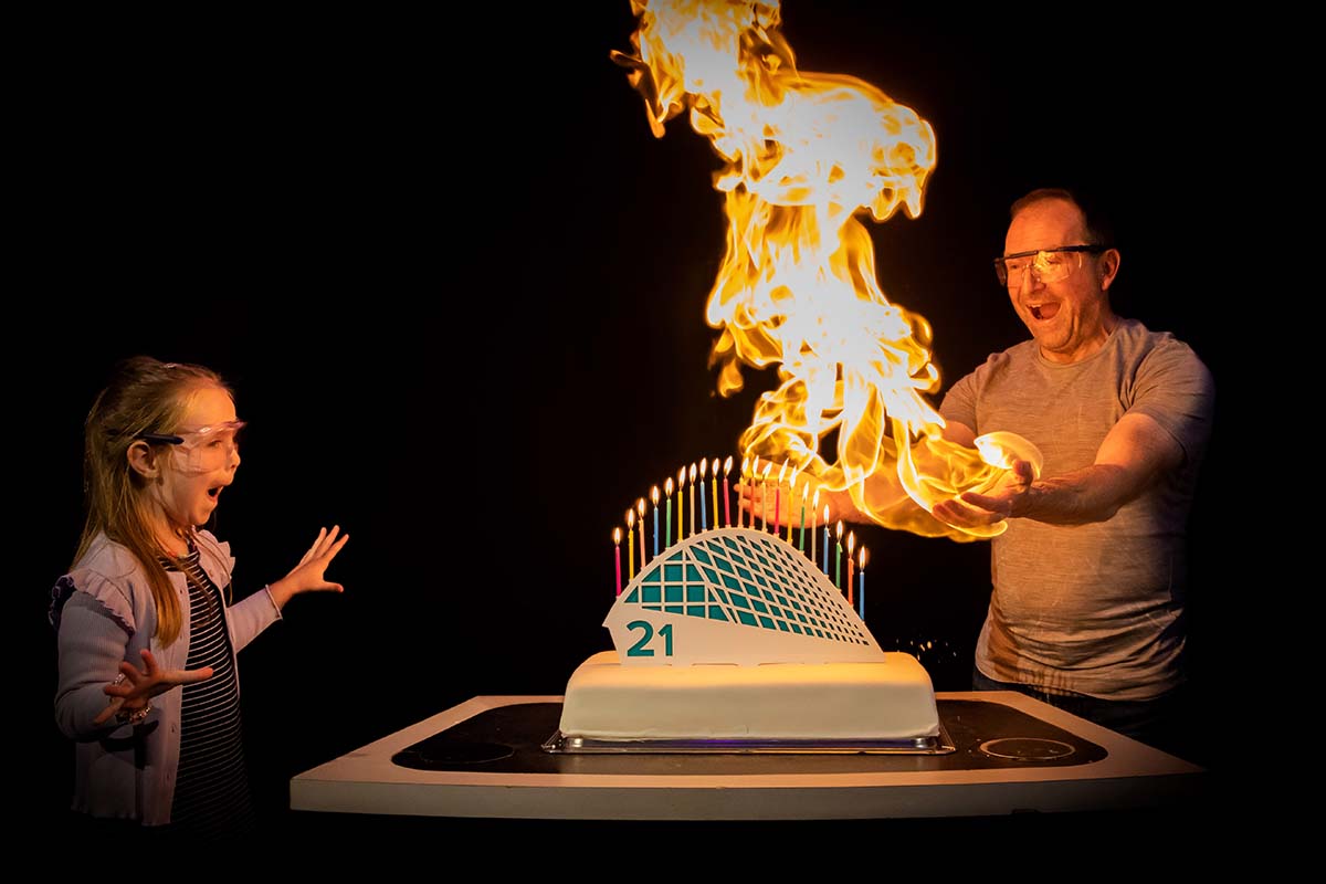Celebrating Glasgow Science Centre turning 21 by lighting a cake with science. Photo shows CEO Stephen Breslin and Laura Wallace (5).