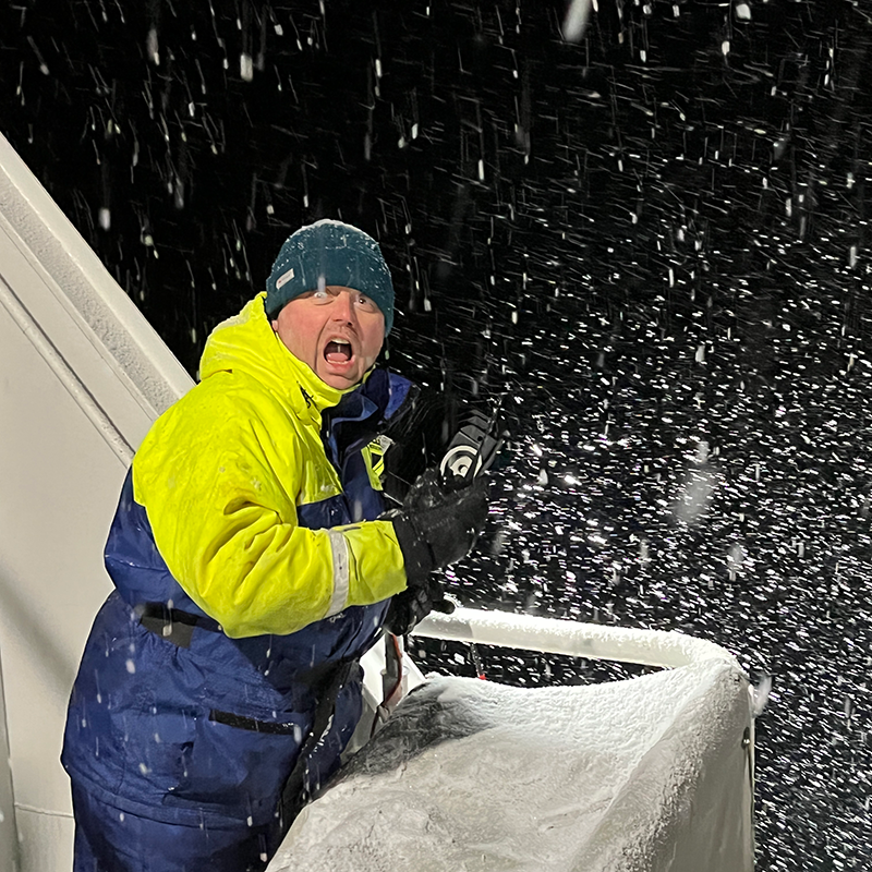 Dr. David McKee on a ship during a snowstorm