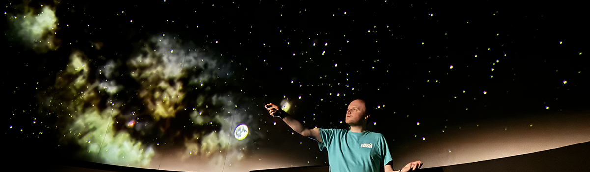 A Planetarium presenter presents a show in the planetarium