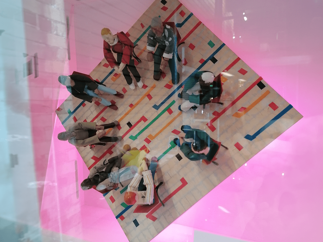 One of the exhibit pieces: A model of the men's group in a circle