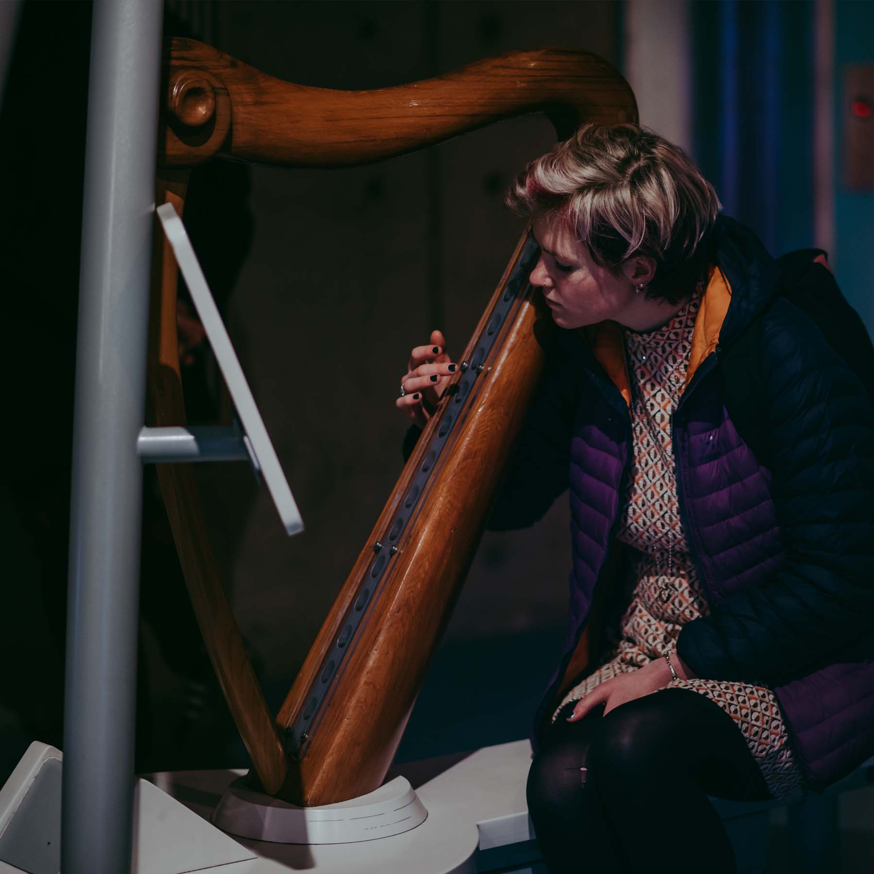 A person plucks the invisible strings of the infra-red harp