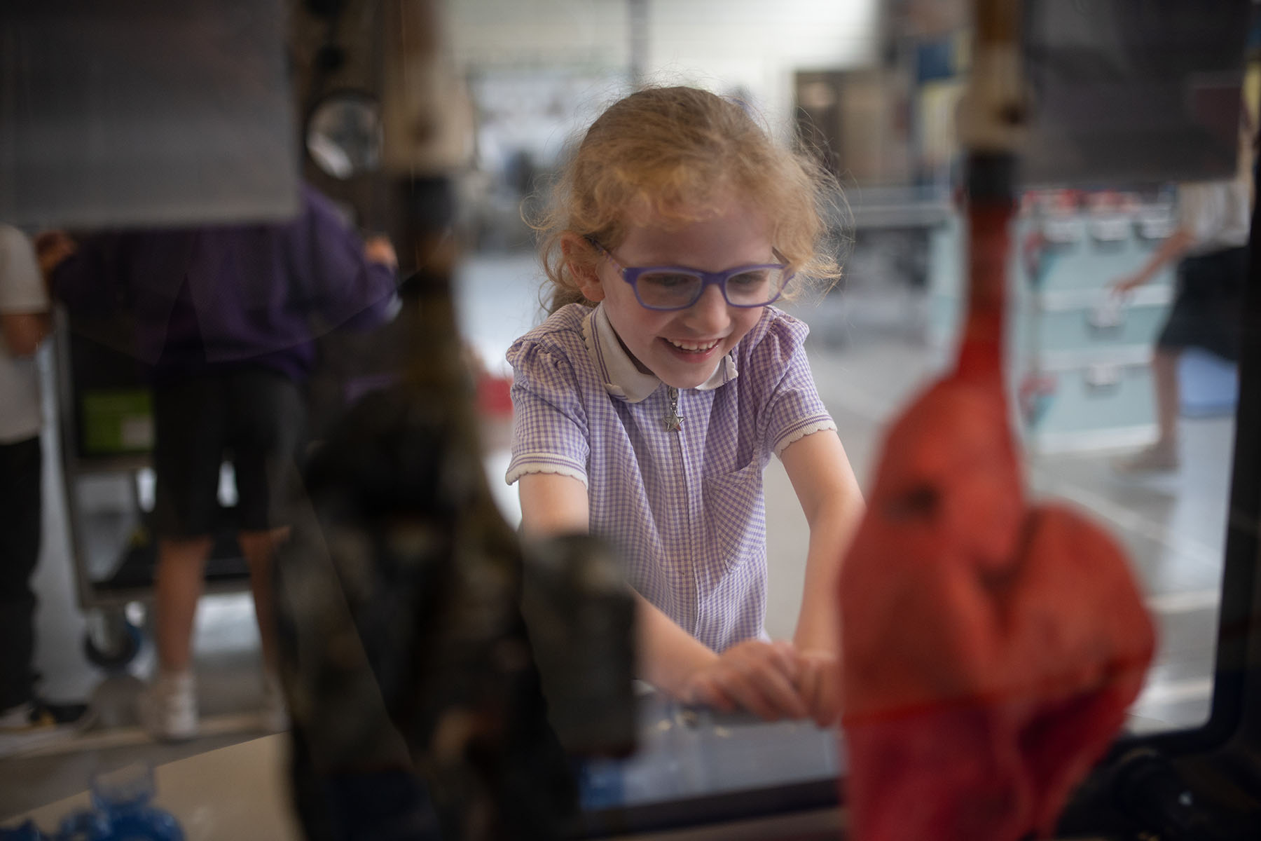 A girl inflates a set of lungs at an interactive exhibit