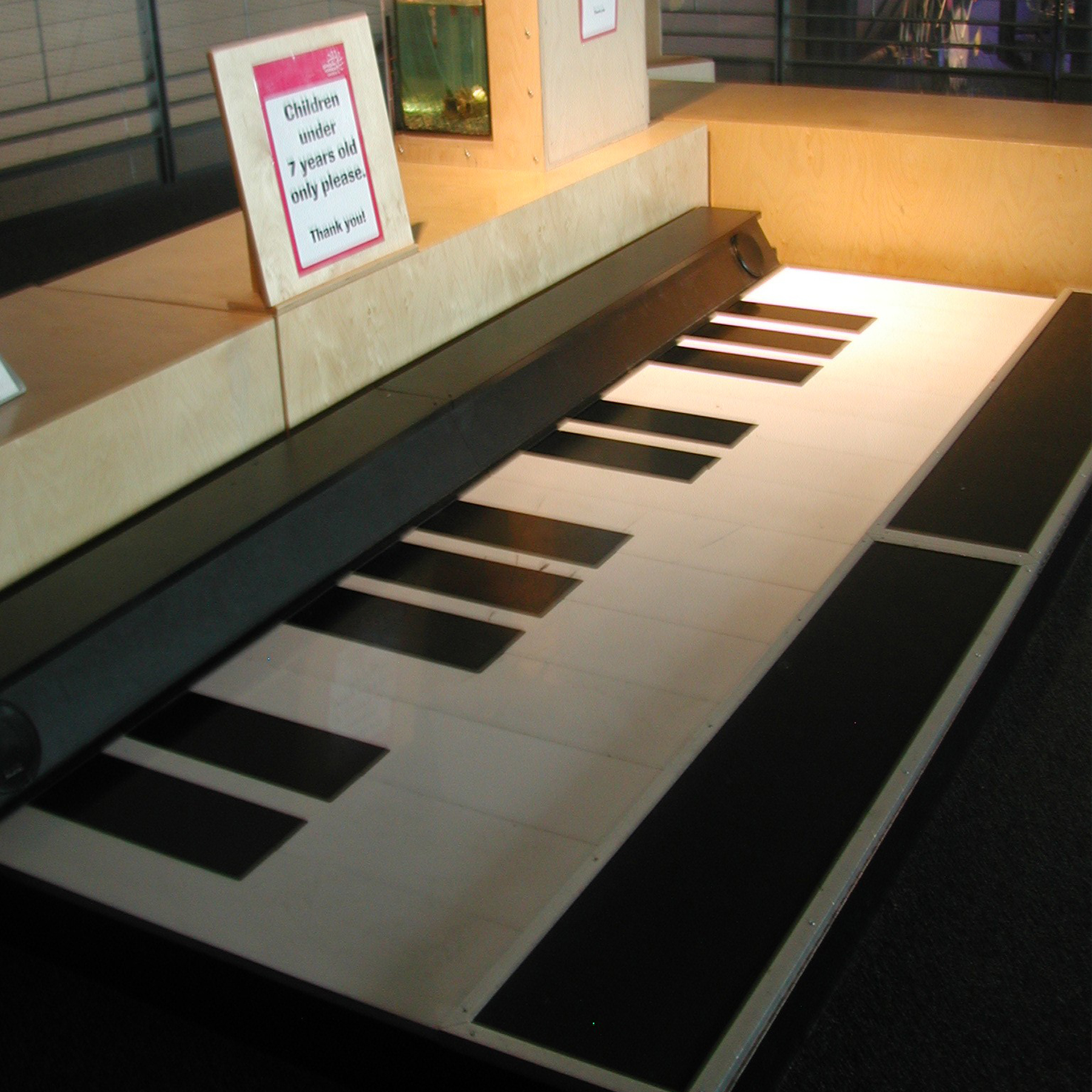A walk on piano in a wooden frame at the science centre