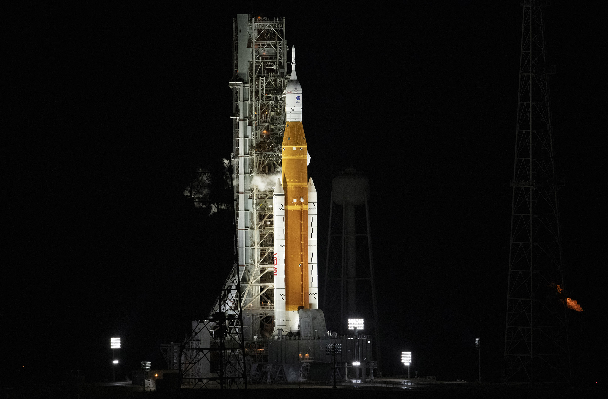 NASA’s Space Launch System (SLS) rocket with the Orion spacecraft aboard is seen atop the mobile launcher at Launch Pad 39B