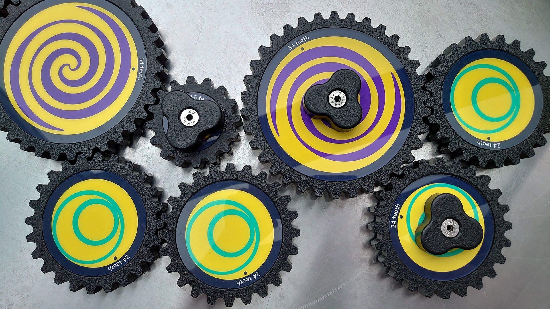 An array of cogs ready to be turned by hand