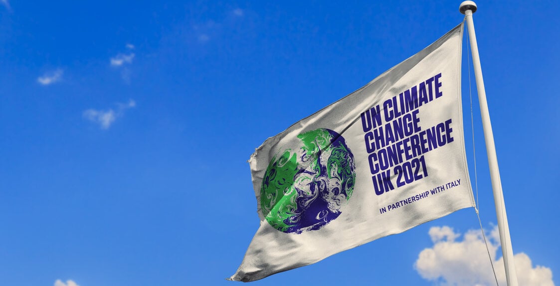 UN Climate Change Conference flag against a blue sky