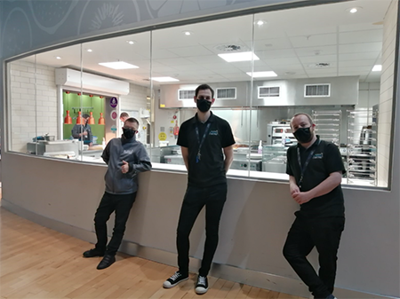 Staff and volunteers at the entrance to the GSC Taste Cafe