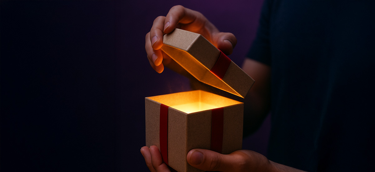 a light shines from within a present as it is opened,