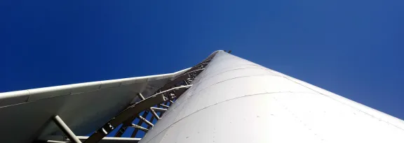 A view looking up from directly under the structure of Glasgow Tower