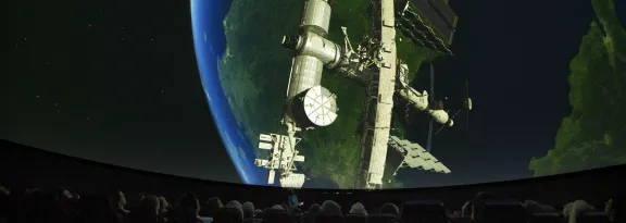 The International Space Station above the Earth as viewed from within the Planetarium at GSC