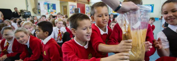 A group of pupils squish a bag representing the contents of a stomach