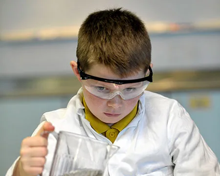 Boy concentrates on experiment