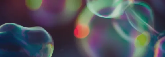 Abstract image of bubbles with greens and purples 