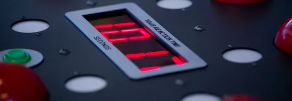 A close up of a reaction timer exhibit