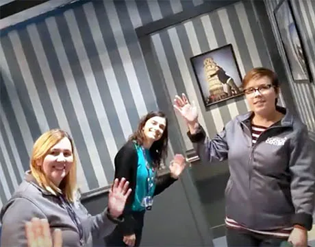 Three science communicators appear to stand at an angle in the Wacky Salon