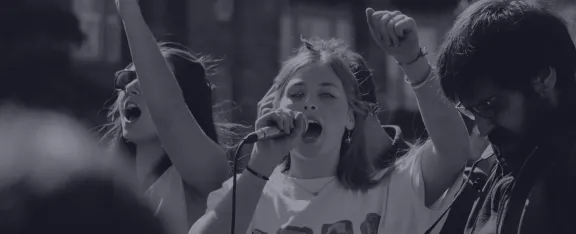 Banner showing person on microphone