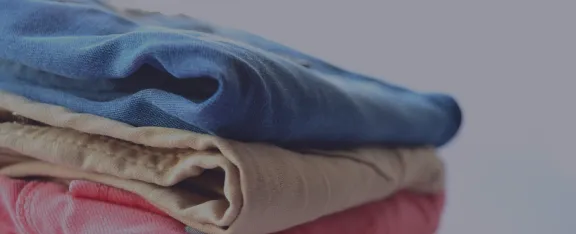 Banner image showing folded up laundry