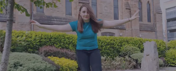Presenter Amy with arms outstretched