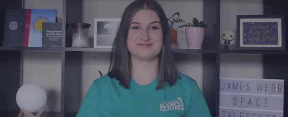 Presenter Natalie sits in front of a bookcase