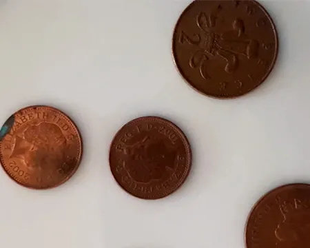 Copper pennies on a plate