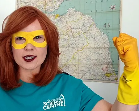 Captain Vortex with their yellow mask and yellow gloved hand