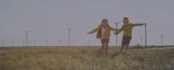 Banner image showing children infront of wind farm