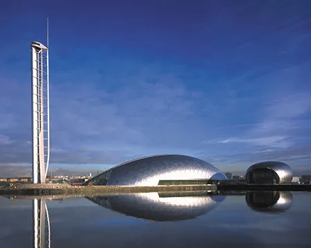 Glasgow Tower and science centre buildings reflected in water