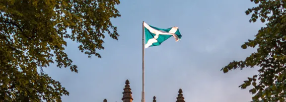 Medieval building with Scottish flag