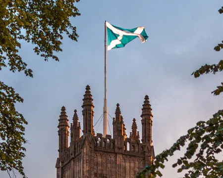 Medieval building with Scottish flag 