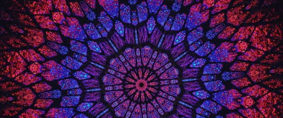 A kaleidoscopic image of purples and blues
