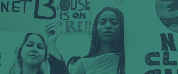 Earth Allies Header - two people at a climate change protest, the image is tinted green