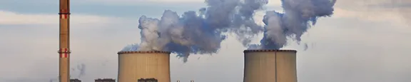 Power plant emitting smoke and steam pollution