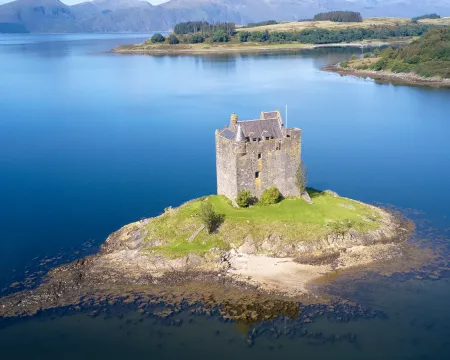 Castle stalker at Port Appin in Argyll and Bute Highlands Scotland aerial birdseye view from above