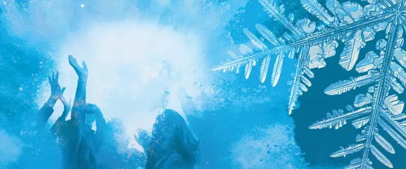 The silhouettes of dancers and a snowflake crystal through a haze of blue light