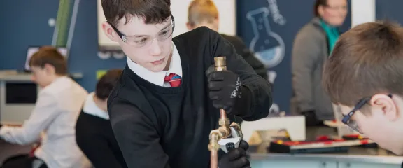 A pupil in an engineering workshop