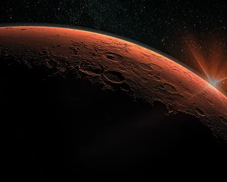 Mars - the red planet's horizon is illuminated in space
