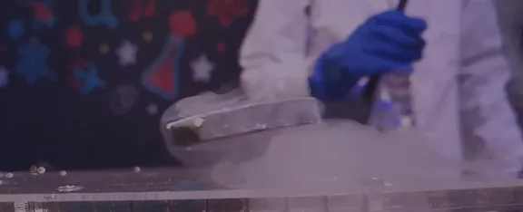 A super cooled magnet hovers above a track