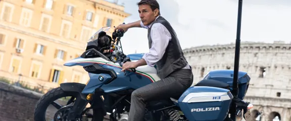 Tom Cruise as Ethan Hunt on a motorbike