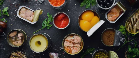 Opened tins of preserved food