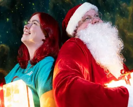 Science Communicator and Santa look at stars
