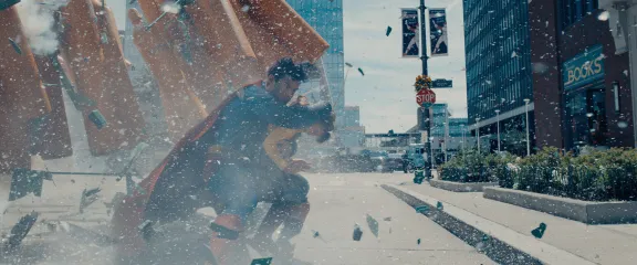 Superman saves a child from an explosion