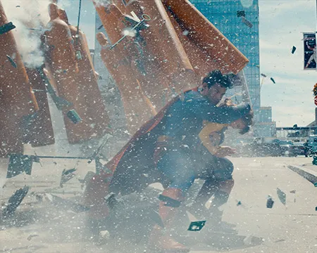 Superman saves a child from an explosion